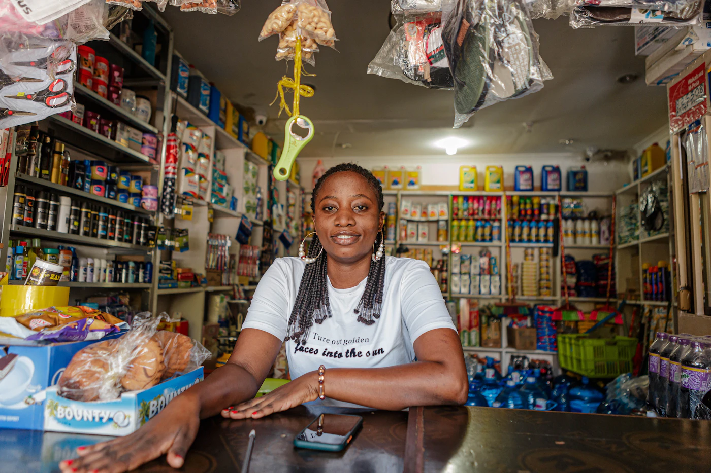 A Nantty seller smiling in her provisions store